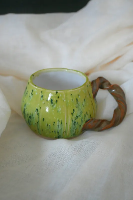 Product: Handmade Green Ceramic Mug with Twisted Handle